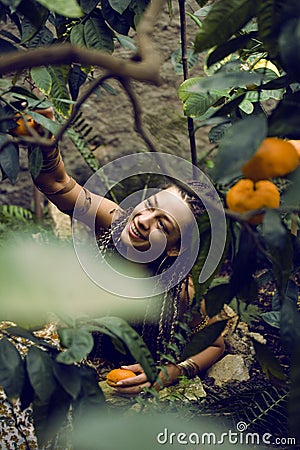 Pretty Islam woman in orange grove smiling Stock Photo