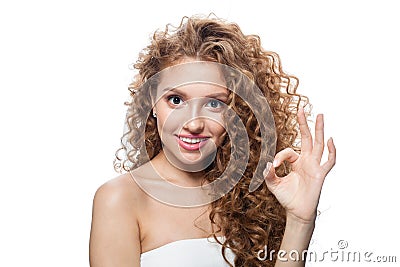 Pretty joyful woman showing ok sign isolated on white. Happy female model with okay symbol Stock Photo
