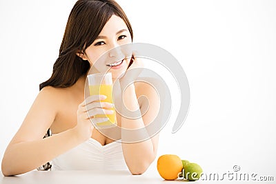 Pretty joyful young woman holding oranges juice Stock Photo