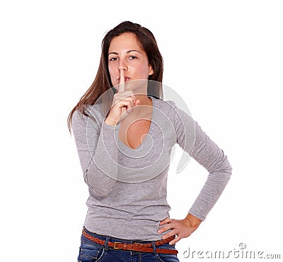 Pretty lady requesting silence with her fingers Stock Photo