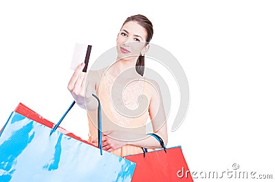 Pretty lady shopper showing credit card and smiling Stock Photo