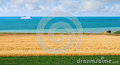 pretty landscape of the coast in northern France with a ferry going along the beach Editorial Stock Photo