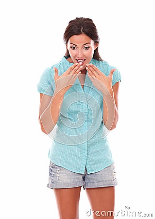 Pretty latin female looking down surprised Stock Photo