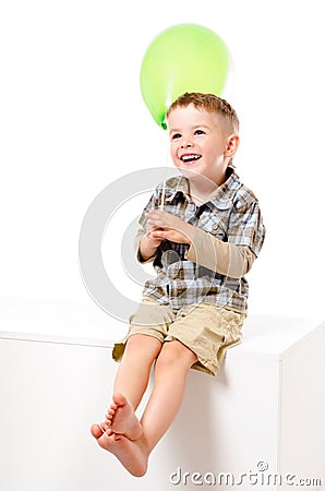 Pretty laughing boy with balloon Stock Photo