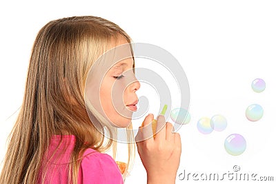 Pretty Little Girl Blowing Bubbles Stock Photo