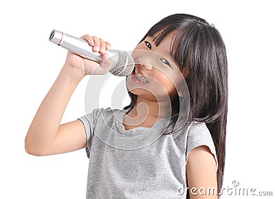 Pretty little girl with the microphone in her hand Stock Photo