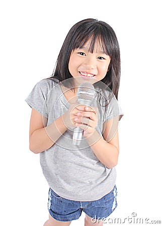 Pretty little girl with the microphone in her hand Stock Photo