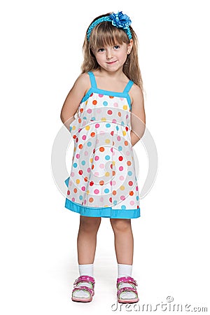 Pretty little girl in polka dot dress Stock Photo