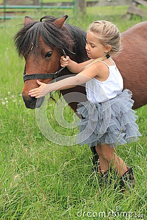 Pretty Little Girl with Pony Stock Photo