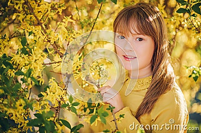 Outdoor fashion portrait of funny 9-10 year old girl Stock Photo