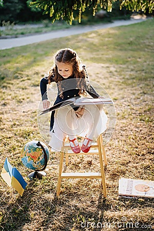 Pretty Little Primary Schoolgirl Read Book Outside Stock Photo