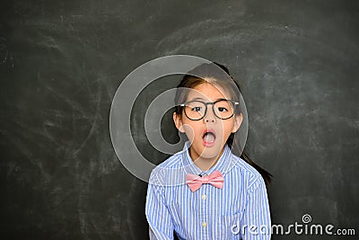 Pretty little teacher shocked looking at camera Stock Photo