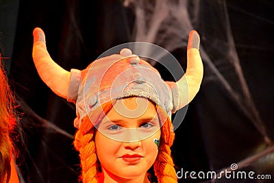 Pretty masquerade viking helmet horns girl Editorial Stock Photo