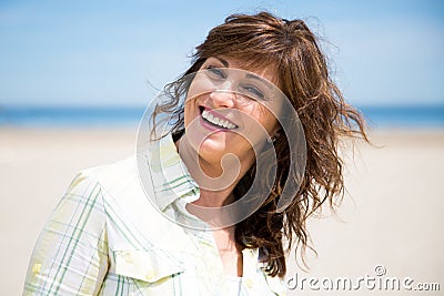 Pretty middle aged woman on the beach Stock Photo