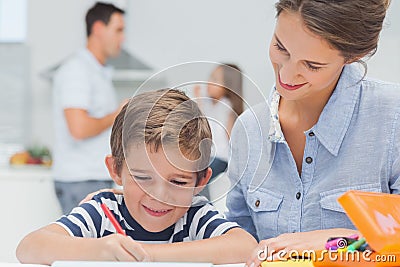 Pretty mother drawing with her son Stock Photo