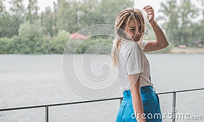 Pretty nice blonde woman in rainy day Stock Photo