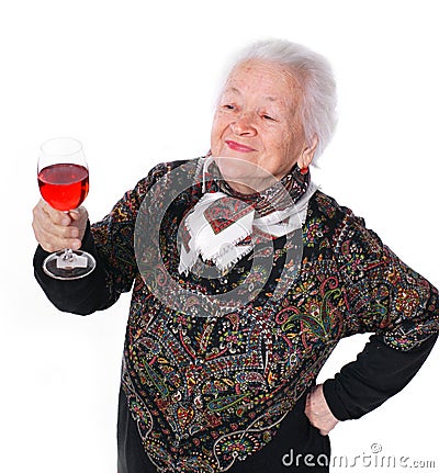 Pretty old woman with glass of wine Stock Photo