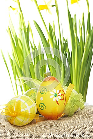 Pretty painted Easter Eggs on hessian Stock Photo