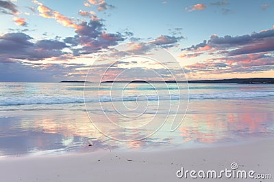 Pretty pastel dawn sunrise at Hyams Beach NSW Australia Stock Photo