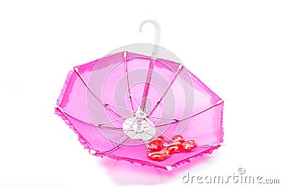Pretty pink parasol with romantic hearts Stock Photo
