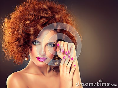 Pretty red haired girl with curls. Stock Photo