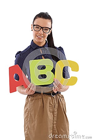 Pretty schoolmistress holding letters abc Stock Photo