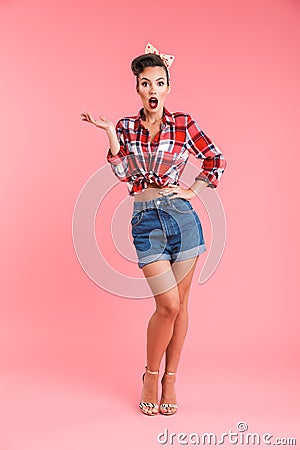 Pretty shocked young pin-up woman Stock Photo