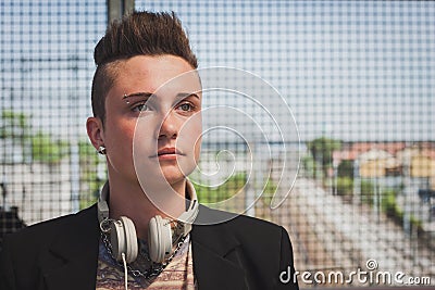 Pretty short hair girl posing on a bridge Stock Photo