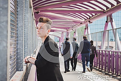 Pretty short hair girl posing on a bridge Stock Photo