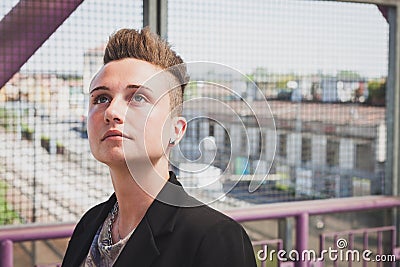 Pretty short hair girl posing on a bridge Stock Photo