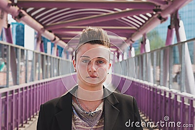 Pretty short hair girl posing on a bridge Stock Photo