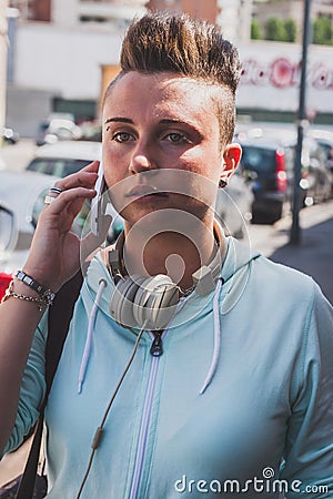 Pretty short hair girl talking on phone Stock Photo