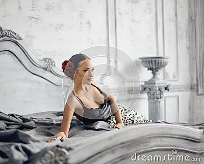 Pretty slim brunette woman resting in luxury room Stock Photo