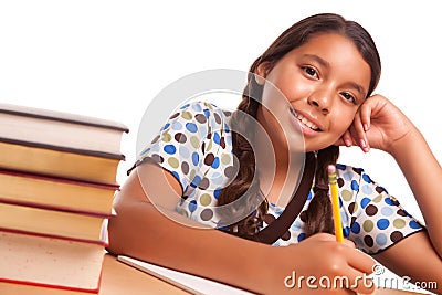 Pretty Smiling Hispanic Girl Studying Stock Photo