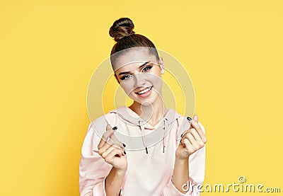 Pretty smiling woman makes mini heart korean love symbol by fingers Stock Photo