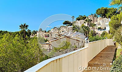 Pretty Spanish white residential houses, modern villas view against blue sky Stock Photo