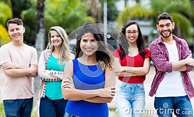 Pretty spanish woman with group of international friends Stock Photo