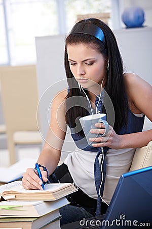Pretty student learning at home Stock Photo