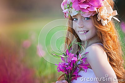 Pretty summer girl with crown of flowers Stock Photo