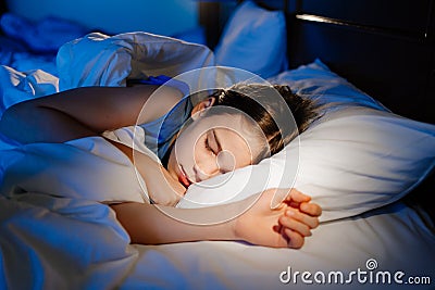 The pretty teen girl naps in bedroom, sees sleep. healthy sleep. Stock Photo