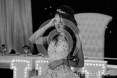 Pretty teen quinceanera birthday girl celebrating in princess dress pink party, special celebration of girl becoming woman. Stock Photo