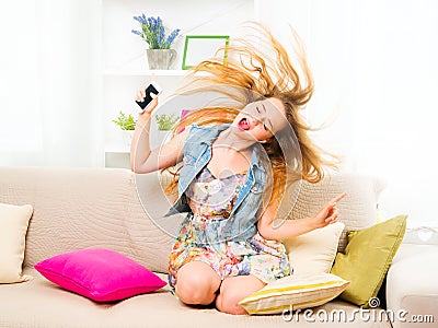 Pretty teenage girl listening music Stock Photo