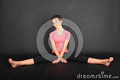 Teenage girl in sportswear sitting astride Stock Photo