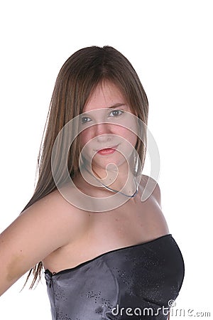 Pretty teenage girl in silver strapless gown Stock Photo