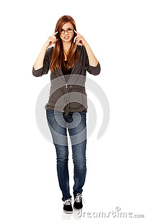 Pretty teenage woman improving glasses Stock Photo