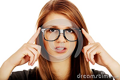 Pretty teenage woman improving glasses Stock Photo