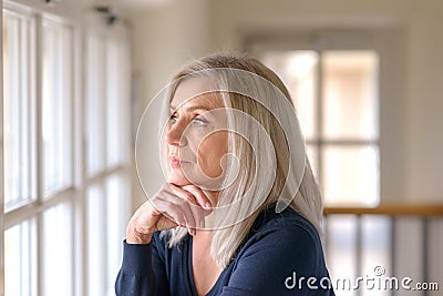 Pretty thoughtful woman with serious expression Stock Photo