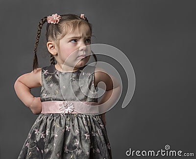 Pretty toddler in pig tails with attitude Stock Photo