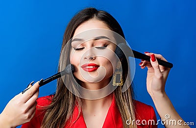 Pretty woman applying makeup brush. Perfect skin tone. Stunning beauty. Makeup supplies shop. Makeup courses. Gorgeous Stock Photo