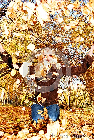 Pretty woman in the autumn park. Stock Photo